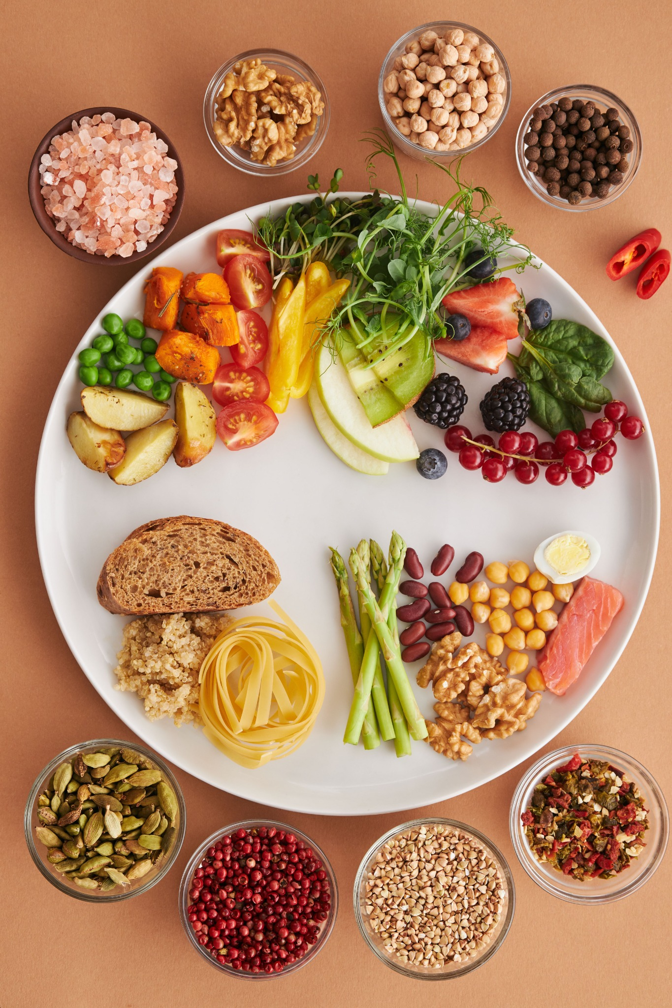 A balanced meal with grains, vegetables, fruit, and spices