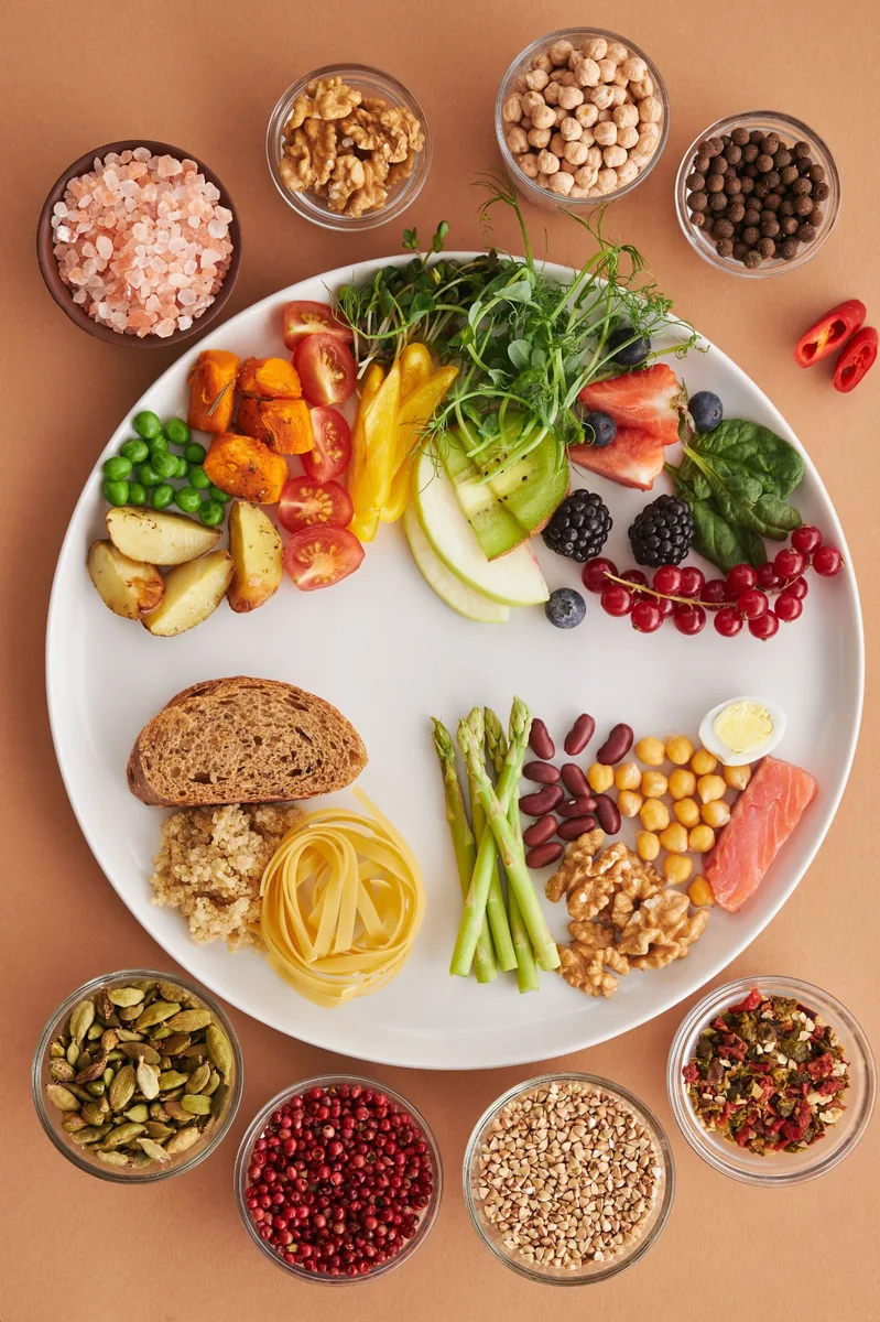 A balanced meal with grains, vegetables, fruit, and spices